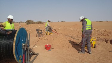 Field team working on fiber optic deployment