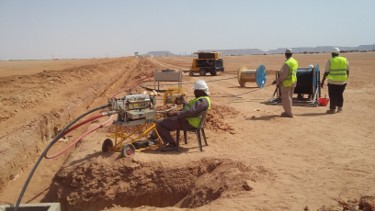 Field team working along a fiber trench