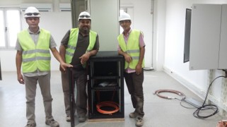 Indoor technical team wearing safety helmets