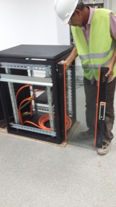 Technician testing rack installation